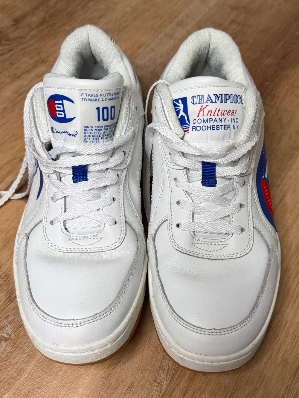 Champion 93 eighteen 100 years show. White Sneakers with Blue & Red Accents.